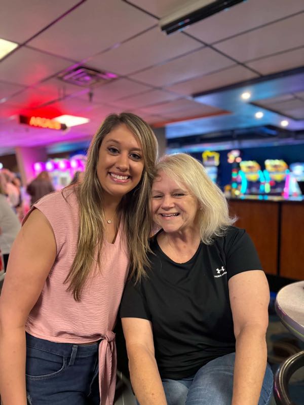 Strike Out Stigma 2026 — Reconstructing Hope supporters posing on the lanes